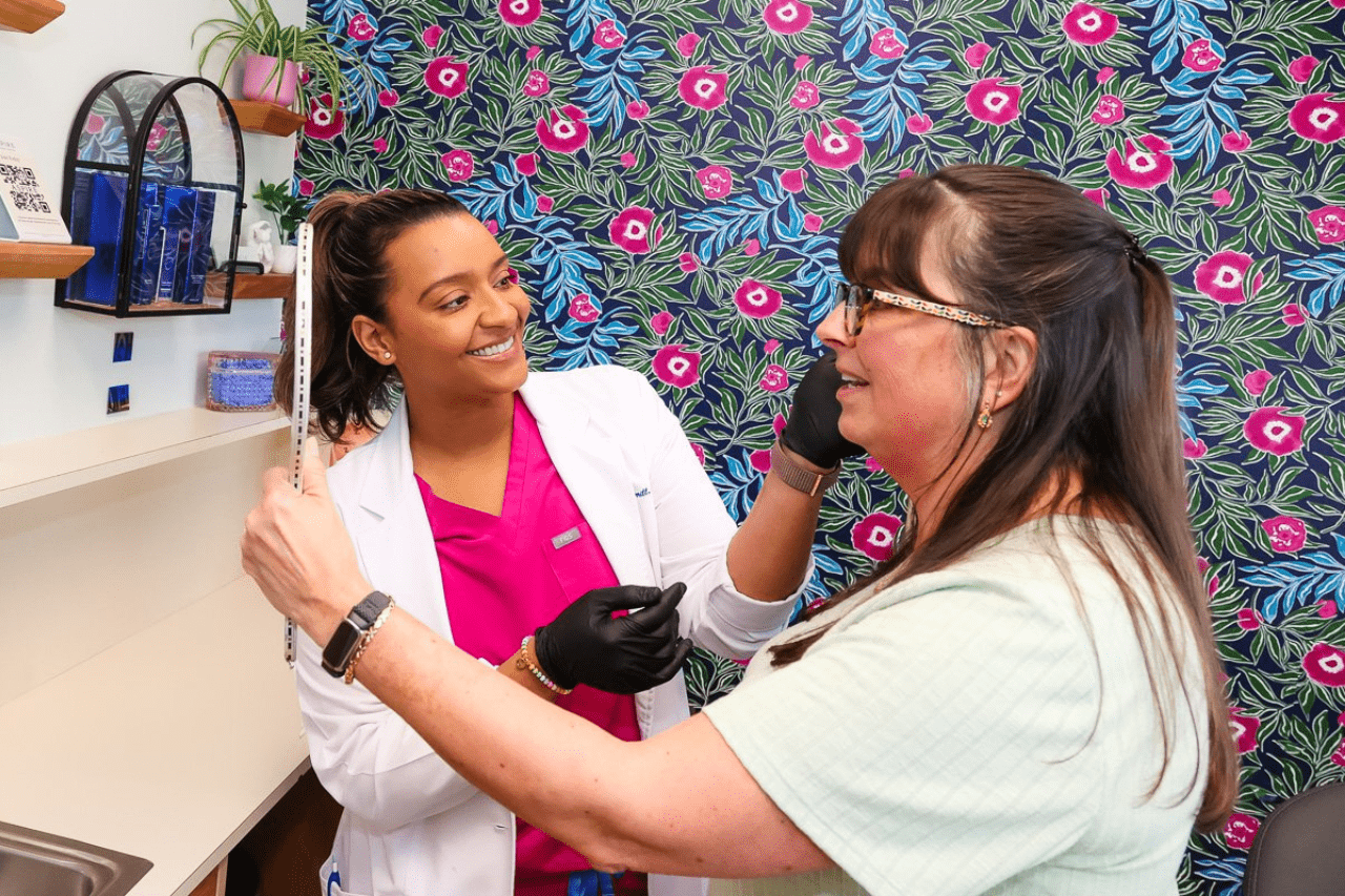 Natasha client Natasha Sherrill consulting with a client at New Age Medspa