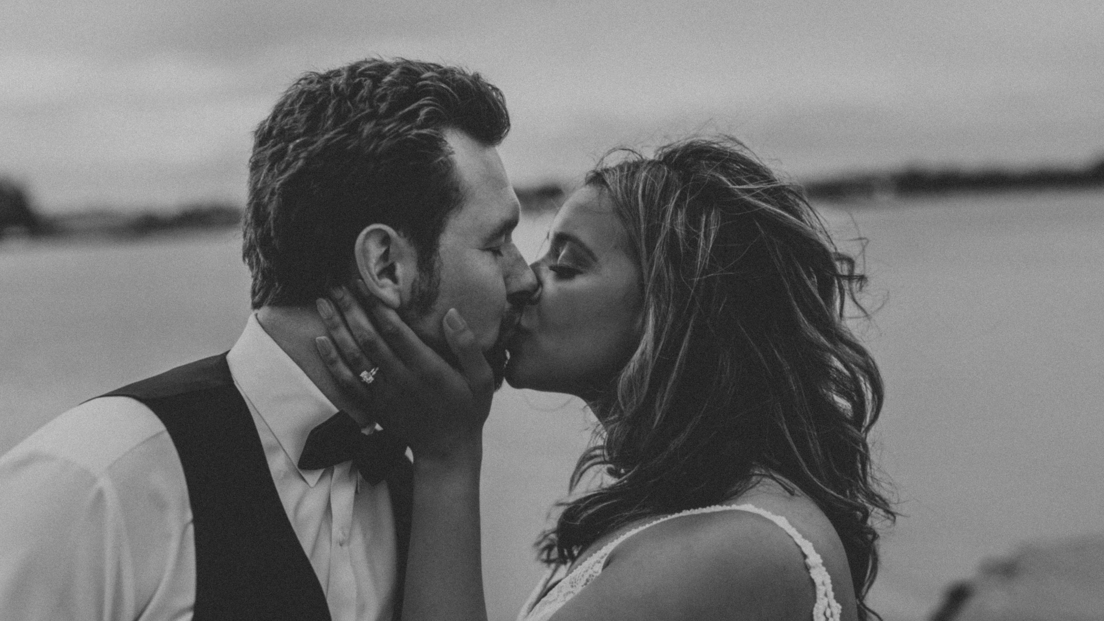 Natasha Sherrill, FNP-C, founder of New Age Medspa, kissing her husband on her Alaska wedding day