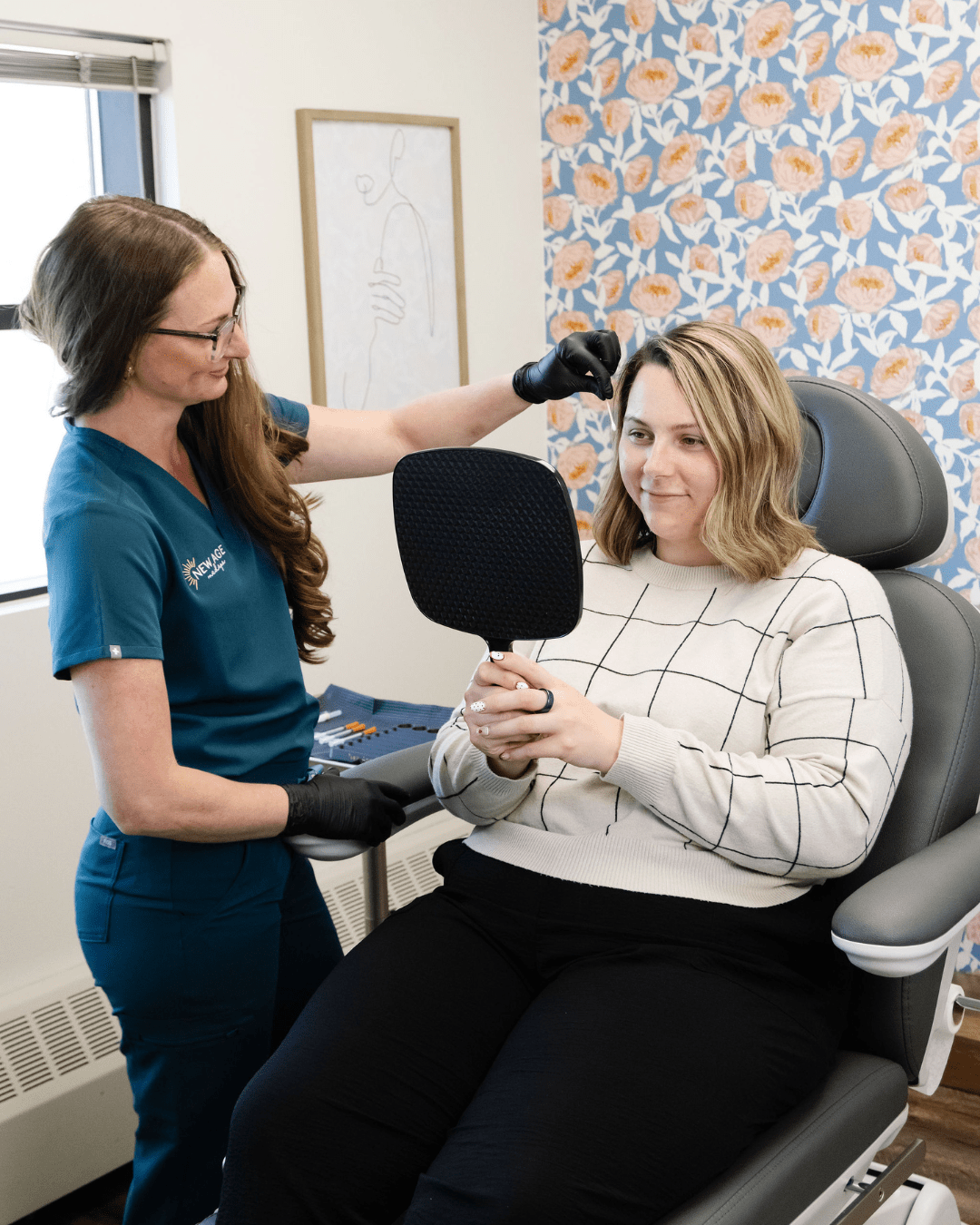 Brie Freckleton, AGACNP consulting with a client at New Age Medspa Anchorage