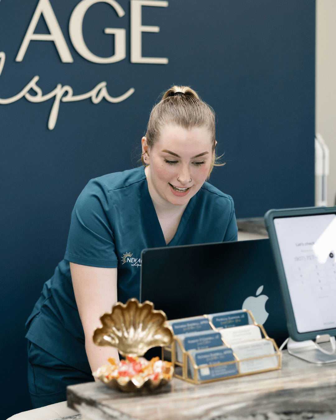 Kassidy O'Connell at the reception desk at New Age Medspa Anchorage