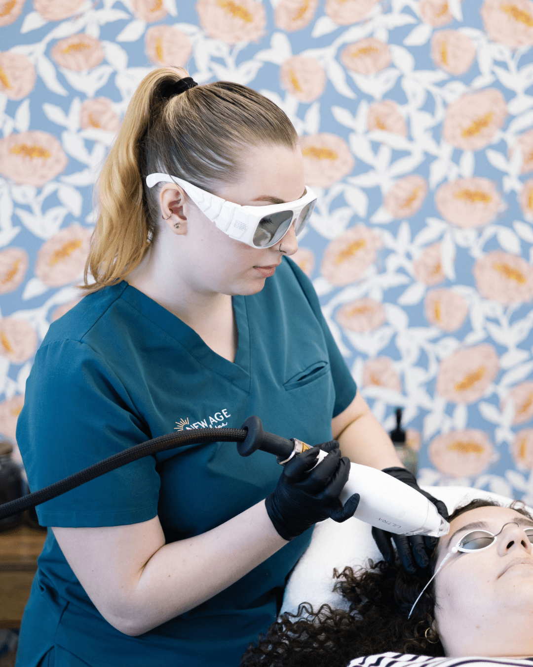 Kassidy O'Connell assisting with an RF microneedling treatment at New Age Medspa
