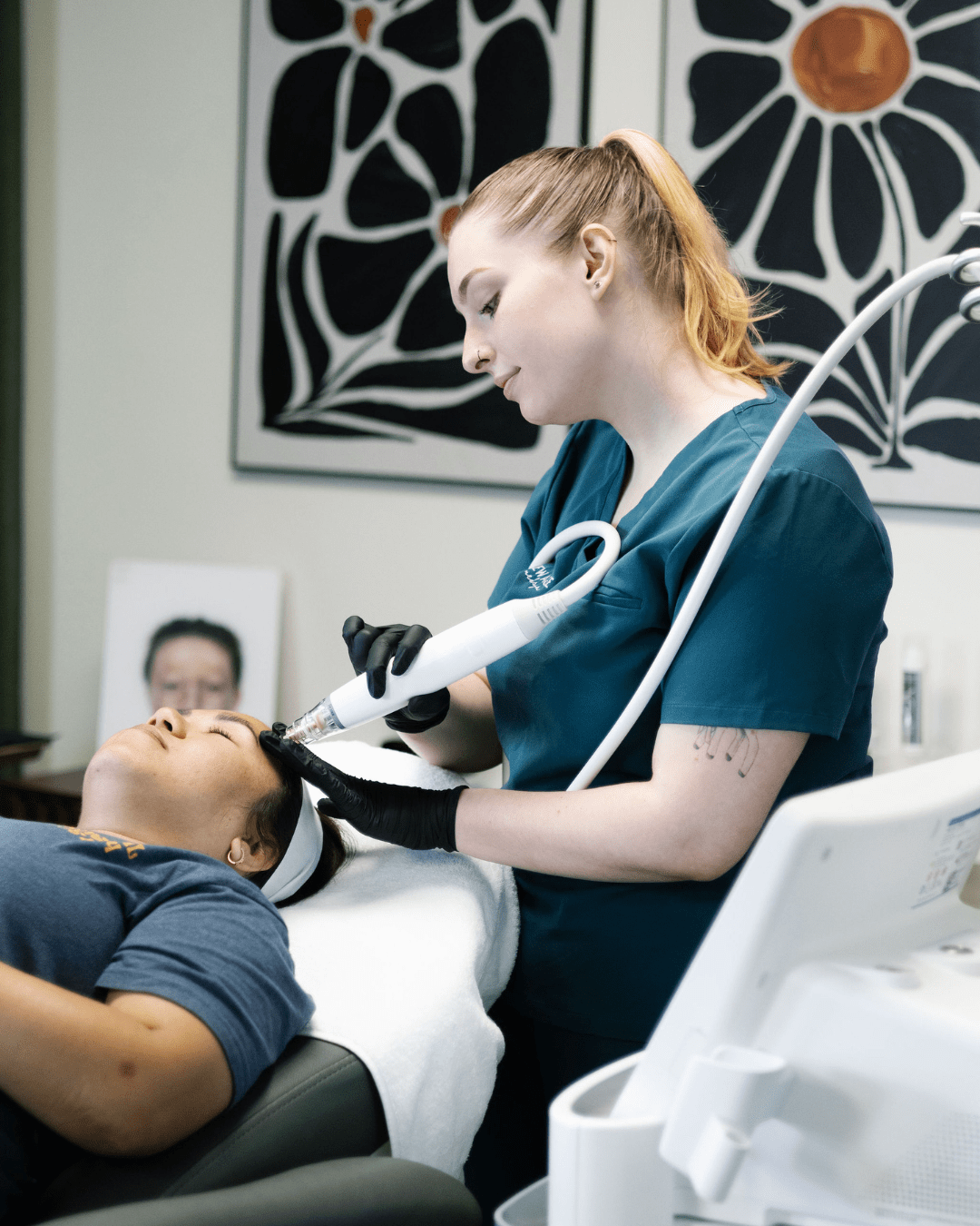 Kassidy O'Connell performing a treatment on a client at New Age Medspa Anchorage