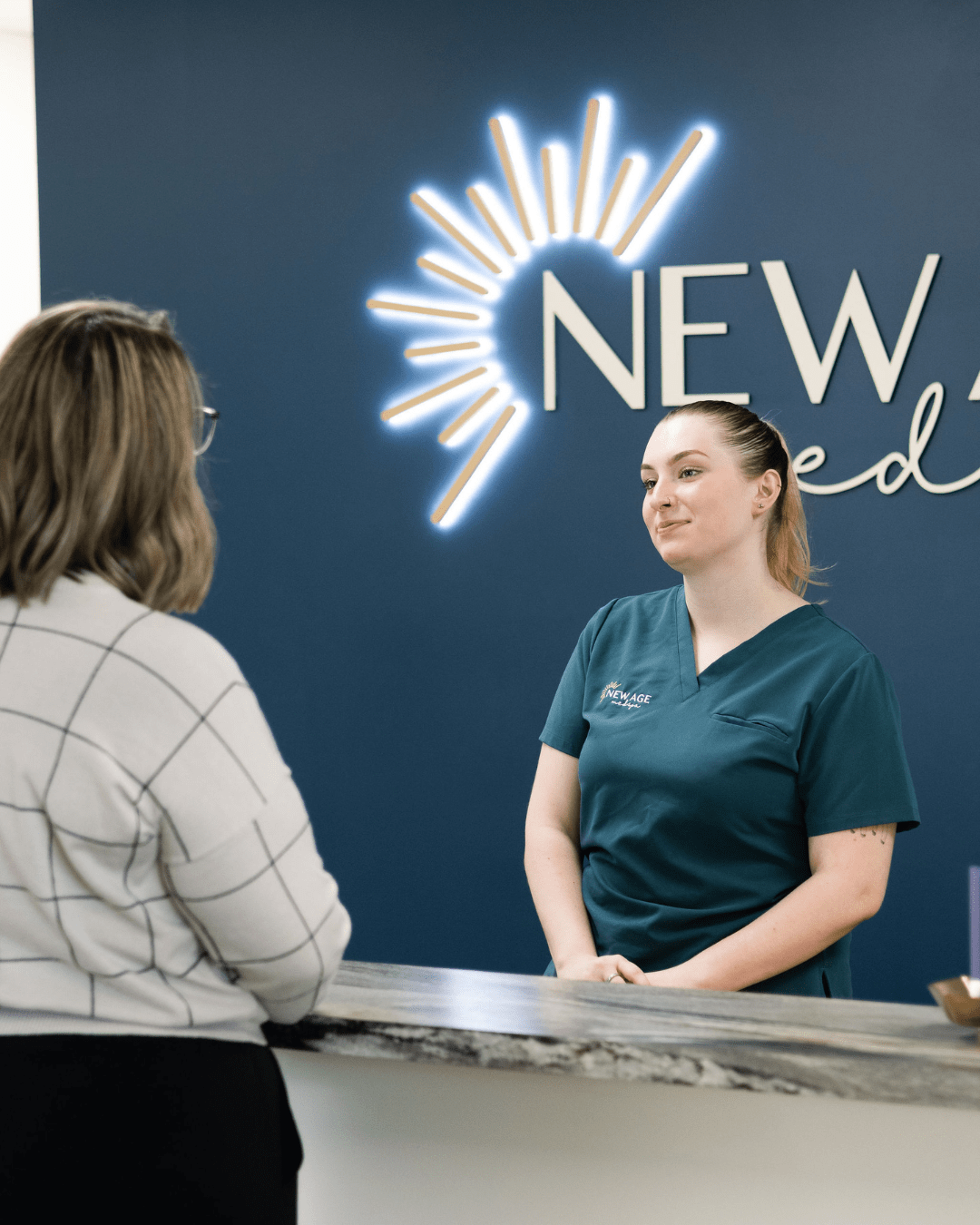 Kassidy O'Connell with a client at New Age Medspa Anchorage